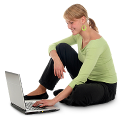 Woman working on computer on floor